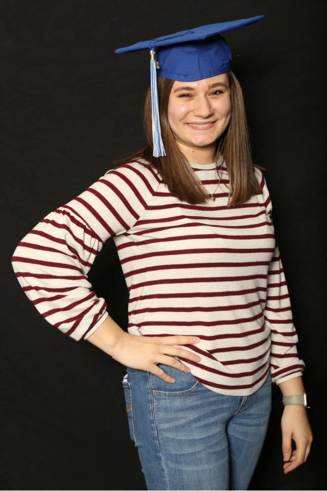 woman in striped shirt smiling